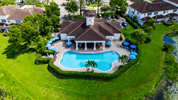 A large house with a pool in the backyard.